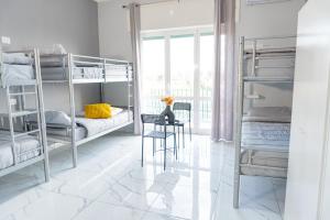 Postel nebo postele na pokoji v ubytování Hostel Partenope