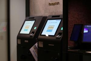 two atm machines with screens on top of them at MERBABU STAY OSAKA in Osaka