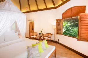 Voodi või voodid majutusasutuse Coco Palm Dhuni Kolhu - 20 percent off roundtrip Seaplane for stays from 1 May to 30 September 2025 toas