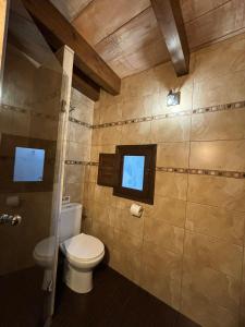 a bathroom with a toilet and a window at Villa Paquita Loft in Deltebre +34 photos