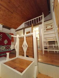 a doll house with a bunk bed and a ladder at Appartement de campagne à Limans in Limans