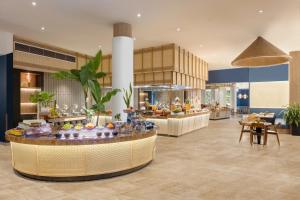 a lobby with a buffet in the middle of a building at Melia Danang Beach Resort in Danang