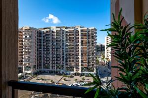 a view of a large apartment building from a window at Bari incanto - 3 Bedroom Apartment & Free Parking in Bari