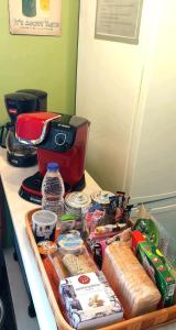 a counter with food and a coffee maker on it at Nest next to the center in Mytilene