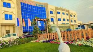 a statue of a swan in front of a building at سيسيليا ريزورت in Hurghada