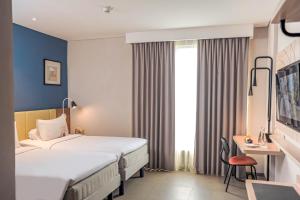 Voodi või voodid majutusasutuse ibis Styles Bogor Pajajaran toas
