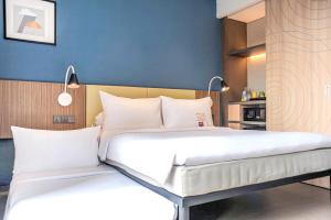 Voodi või voodid majutusasutuse ibis Styles Bogor Pajajaran toas
