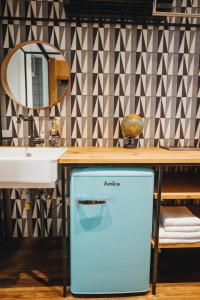 A kitchen or kitchenette at City Glamping by ONE66 Hotel