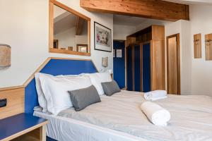Postel nebo postele na pokoji v ubytování Hotel garni Meledrio