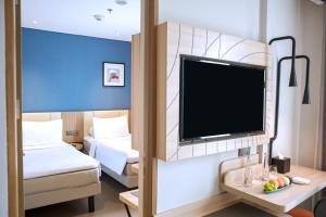 Voodi või voodid majutusasutuse ibis Styles Bogor Pajajaran toas