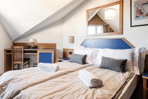 Postel nebo postele na pokoji v ubytování Hotel garni Meledrio