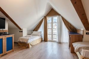 Postel nebo postele na pokoji v ubytování Hotel garni Meledrio + 37 fotografií