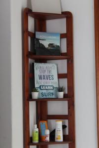 a wooden shelf with some products on it at Famara Home stay in Famara