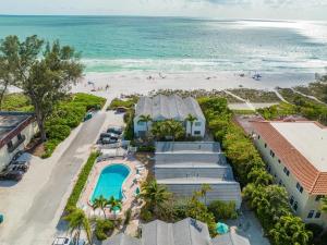 an aerial view of a resort and the beach at Coconuts Poolside #115 in Holmes Beach