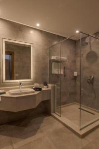 a bathroom with a sink and a shower at Tolip Resort Sunrays New- Alamein in El Alamein