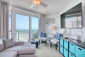 a living room with a couch and a view of the ocean at 2501 S Ocean Blvd, 1031 - Ocean View Sleeps 8 in Myrtle Beach