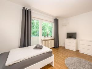 מיטה או מיטות בחדר ב-Apartments with Balcony in Lippstadt