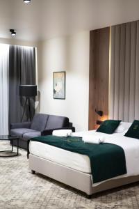 Postel nebo postele na pokoji v ubytování Restoria Hotel***
