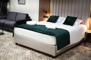 Postel nebo postele na pokoji v ubytování Restoria Hotel***