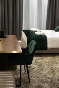 Postel nebo postele na pokoji v ubytování Restoria Hotel***