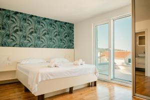 Кровать или кровати в номере Luxury Blue Villas Vis