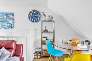 a dining room with a table and chairs at 17 At The Beach, Torcross in Torcross +25 photos