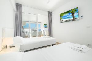 Posteľ alebo postele v izbe v ubytovaní Santa Margarita Deluxe 14-D Levante Beach