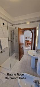 a bathroom with a shower and a tub and a sink at Corte dei Sisanda1 in Galzignano