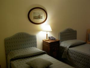 Letto o letti in una camera di Relais Villa Rossi