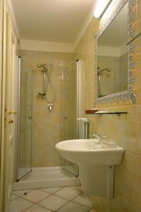 a bathroom with a sink and a shower at Relais Villa Rossi in Silvi Marina +47 photos