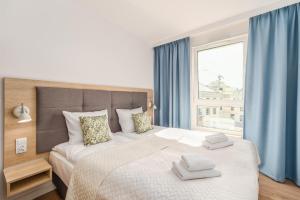 Posteľ alebo postele v izbe v ubytovaní Perfect Holiday Apartments Bel Mare by Noclegi Renters