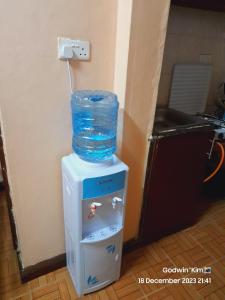 a bottle of water sitting on top of a box at Sifa Stays in Ongata Rongai 