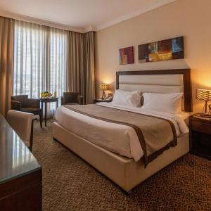 Säng eller sängar i ett rum på Atlantic Resort