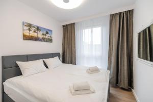 Posteľ alebo postele v izbe v ubytovaní Perfect Holiday Apartments Bel Mare by Noclegi Renters
