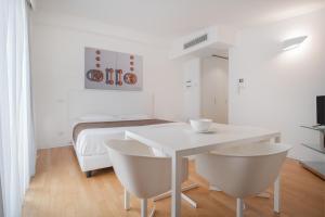 TV a/nebo společenská místnost v ubytování Felix Hotels - Residence Hotel Grandi Magazzini