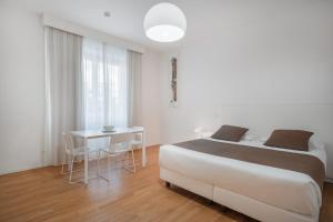 Postel nebo postele na pokoji v ubytování Felix Hotels - Residence Hotel Grandi Magazzini