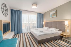 Posteľ alebo postele v izbe v ubytovaní Perfect Holiday Apartments Bel Mare by Noclegi Renters