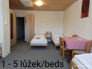 Postel nebo postele na pokoji v ubytování Penzion Na Sluníčku