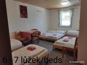 Postel nebo postele na pokoji v ubytování Penzion Na Sluníčku