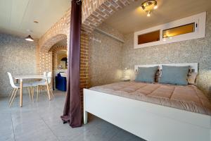 Postel nebo postele na pokoji v ubytování Hauzify I Apartament Plenamar