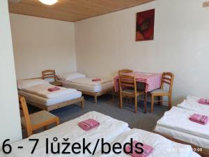 Postel nebo postele na pokoji v ubytování Penzion Na Sluníčku