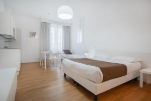 Postel nebo postele na pokoji v ubytování Felix Hotels - Residence Hotel Grandi Magazzini