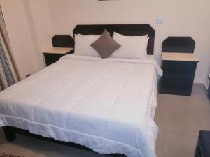 Säng eller sängar i ett rum på Regina Resort El Sokhna