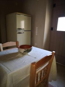 a kitchen with a table with a bowl on it at Casa Opuntia in Pappayiannádhes