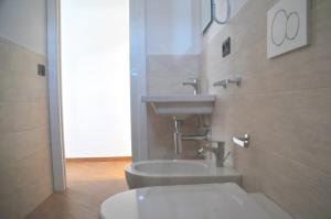 a bathroom with a sink and a toilet at Hotel Sette Note in Silvi Marina