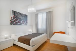 Postel nebo postele na pokoji v ubytování Felix Hotels - Residence Hotel Grandi Magazzini
