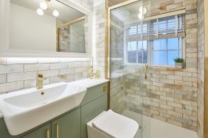 a bathroom with a sink and a toilet and a mirror at Host & Stay - Bentley Wynd in Yarm