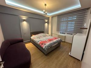 מיטה או מיטות בחדר ב-Kadıköy