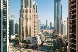 an aerial view of a city with tall buildings at Magnificent Cozy 2BR in Downtown Dubai in Dubai