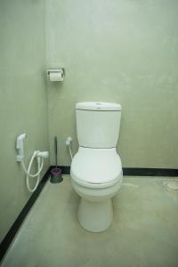 a bathroom with a white toilet in a room at Villa Kavee in Galle +34 photos